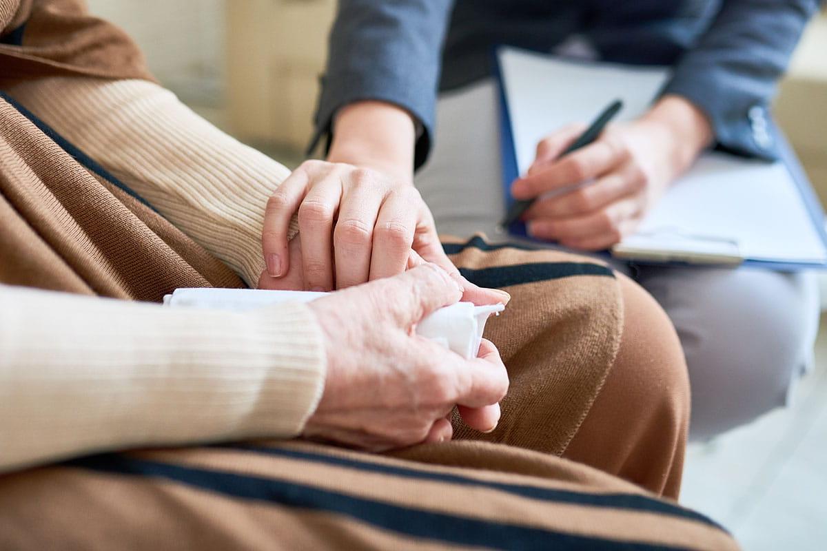 Closeup of someone's hands holding a tissue